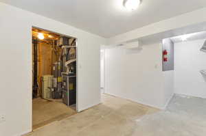 Basement with water heater and laundry room.