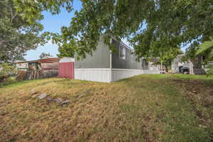 View of yard with an outdoor structure