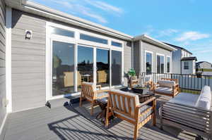 Wooden deck with an outdoor living space