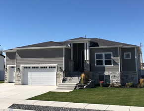 Prairie-style house with a front yard and a garage