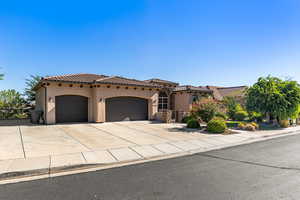 Mediterranean / spanish-style home featuring a garage