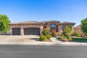 Mediterranean / spanish-style home featuring a garage