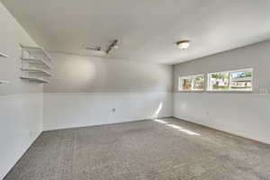 Sunny, quiet family room with shelving