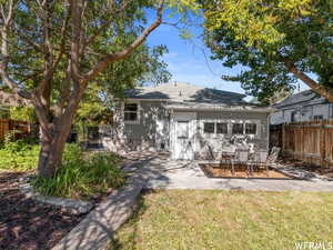 Rear view of house featuring a patio