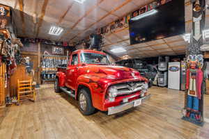 Garage with white refrigerator with ice dispenser