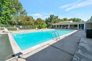 View of swimming pool featuring a patio