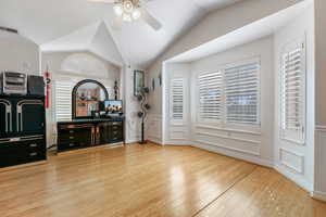 Bedroom featuring lofted ceiling, hardwood / wood-style flooring, and ceiling fan