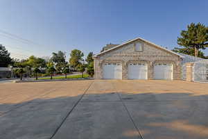 View of property exterior featuring a garage