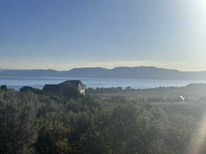 Property view of mountains featuring a water view