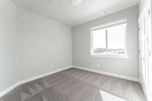 Unfurnished bedroom featuring carpet floors