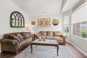 Living room with hardwood / wood-style flooring