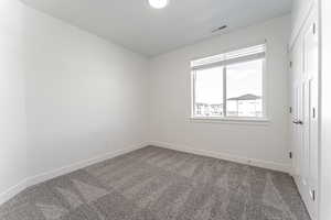 View of carpeted spare room