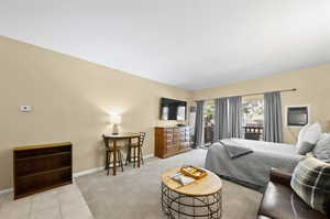 Bedroom with light tile patterned floors