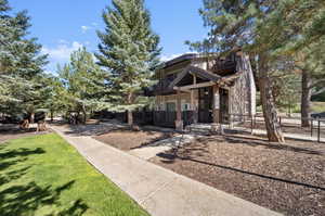 View of front of home featuring a balcony