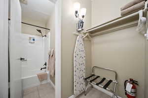 Spacious closet featuring light tile patterned floors