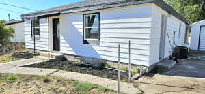 View of property exterior with central AC unit