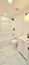 Full bathroom with toilet, vanity, shower / tub combination, and tile patterned floors