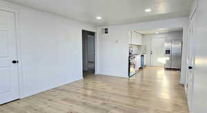 Interior space with sink and light wood-type flooring