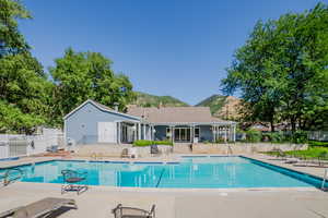 View of pool featuring a mountain view and a patio