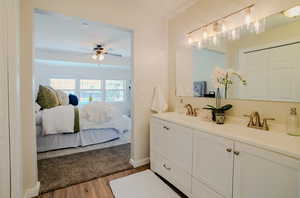 Bathroom with ceiling fan, vanity, and hardwood / wood-style floors