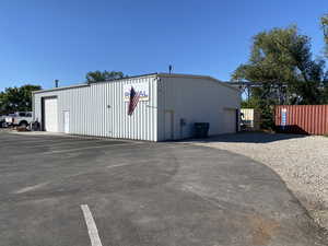 View of outdoor structure featuring a garage