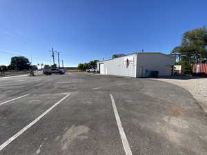 View of vehicle parking featuring a garage