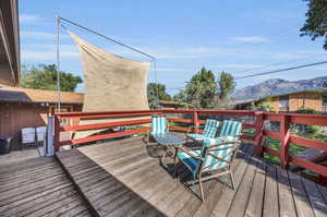 Deck with a mountain view, sunshade/movie screen.