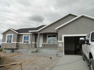 View of front facade featuring a garage