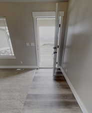 Entryway with hardwood / wood-style floors