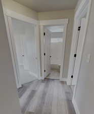 Hall featuring light hardwood / wood-style flooring