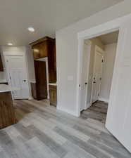 Spare room with light wood-type flooring