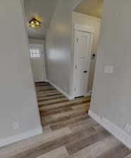 Foyer with light hardwood / wood-style flooring