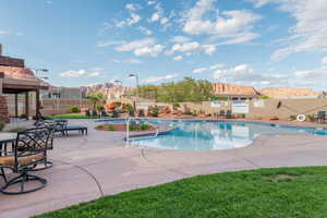 View of pool featuring a mountain view and a patio