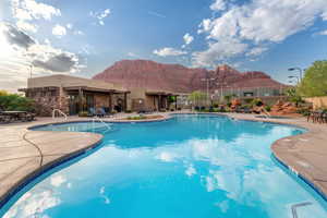 View of pool featuring a patio area and a mountain view