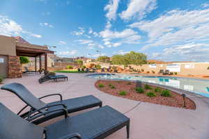 View of swimming pool with a patio area