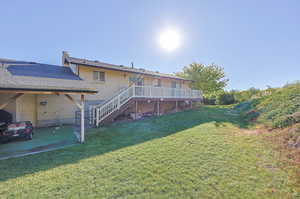 View of yard featuring a wooden deck