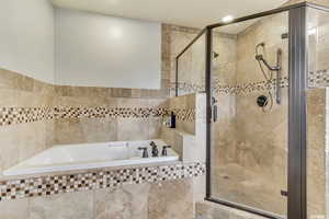 Ensuite Bathroom with walk in shower and luxurious soaker tub.