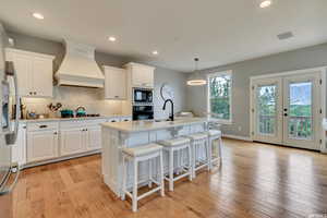 Remodeled Kitchen:  Quartz countertops, backsplash, Miele appliances, custom exhaust hood, stainless steel sink. Notice the French doors that lead to a balcony for more mountain views.