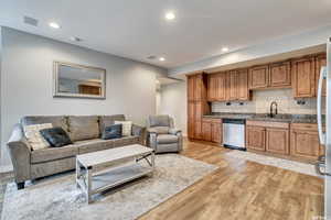 Basement living room open to kitchen.