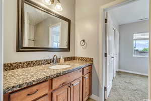 Basement ensuite bathroom with vanity.