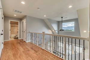 Upstairs Balcony: Upstairs balcony that overlooks the living area and leads into two upstairs bedrooms. Also, one can look out into the views of the Wasatch mountains.