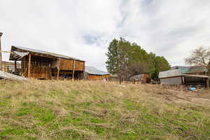 View of yard with hay barn