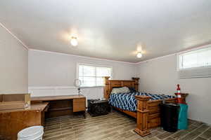 Bedroom featuring a textured ceiling and tile flooring