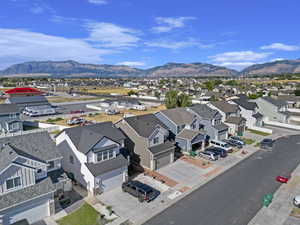 Birds eye view of property with a mountain view