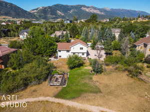 Birds eye view of property featuring a mountain view