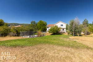 View of yard with a deck