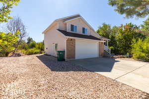 View of property exterior with a garage