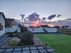 View of yard at dusk