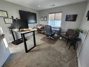 Office with light colored carpet