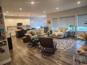 Living room with hardwood / wood-style floors